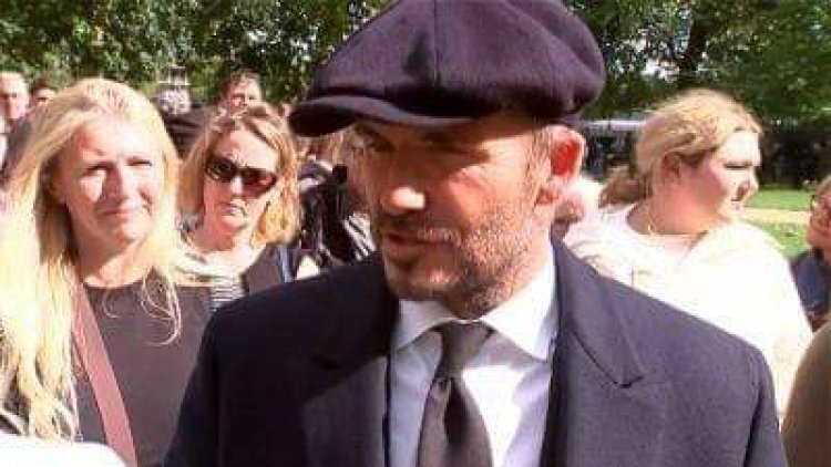 David Beckham joins thousands queuing for over 12 hours to view the Queen Lying in State
